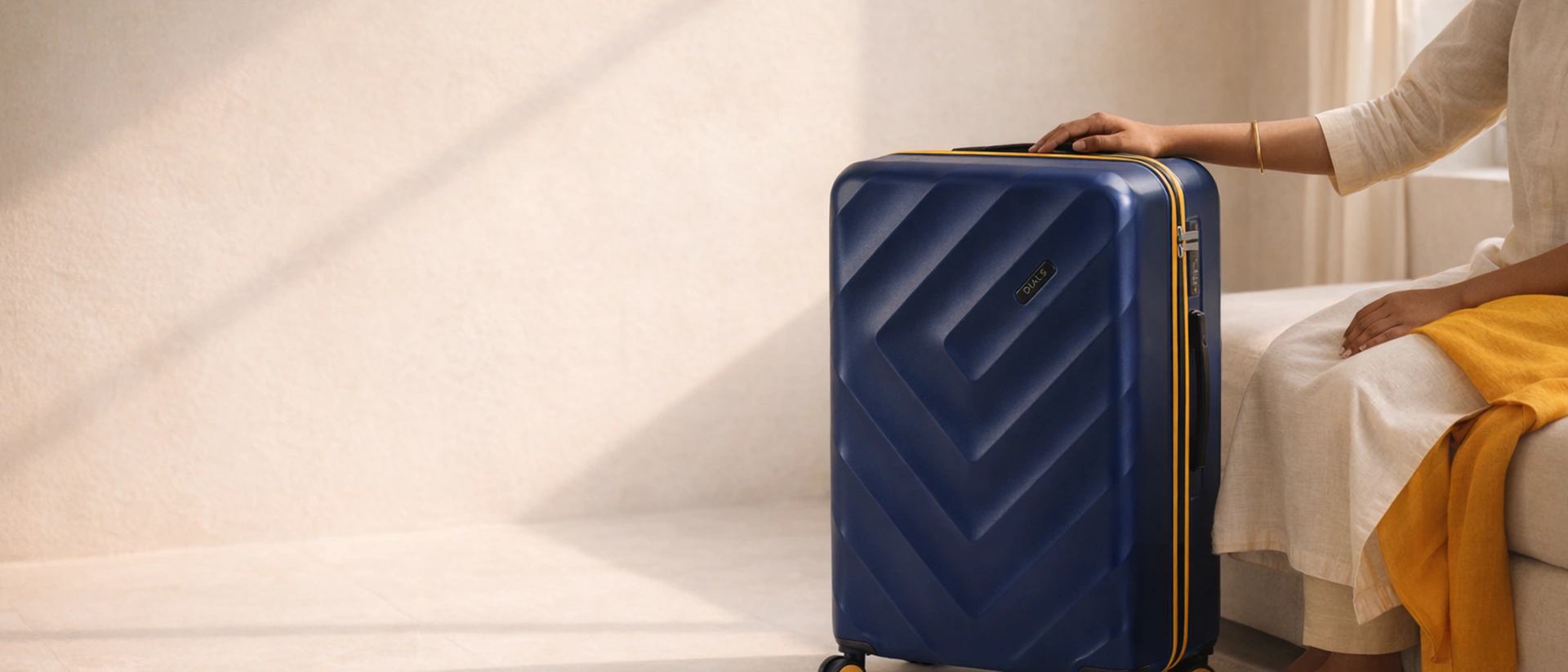 A woman resting a hand on the royal blue Ranger case in a sunlit room