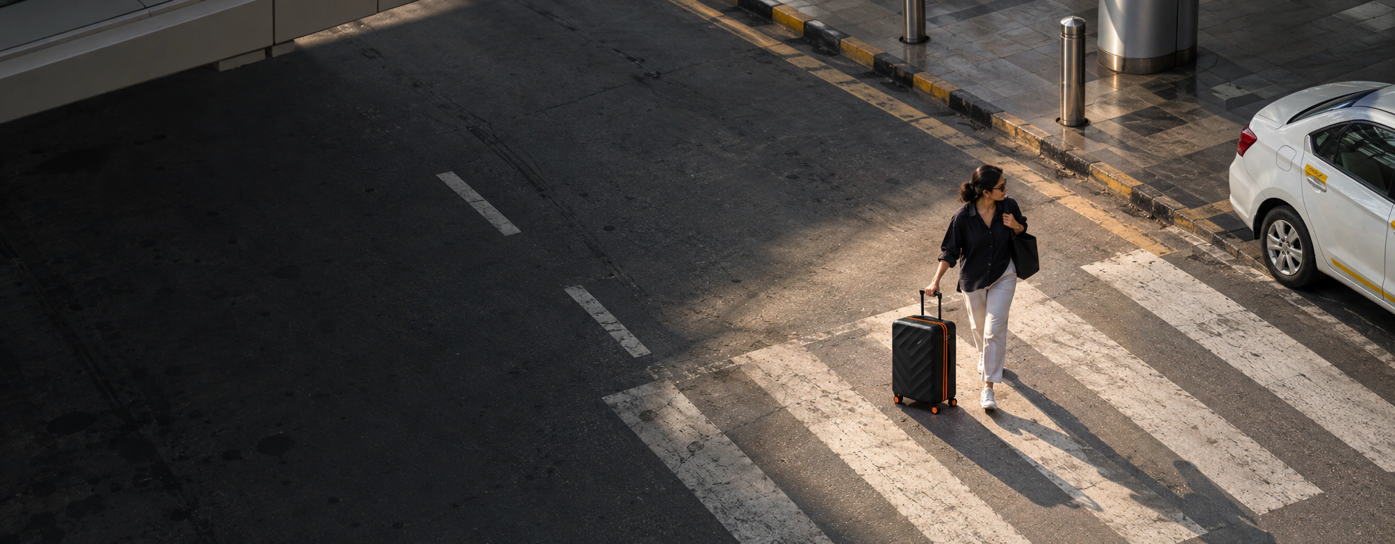 A woman travelling alone for work, pulling a black Series 01 Ranger cabin